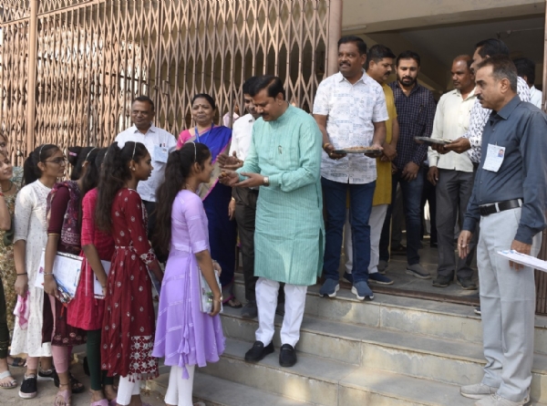 Deputy Chief Inspector Jagdish Makwana greeting the board examinees with a sweet smile