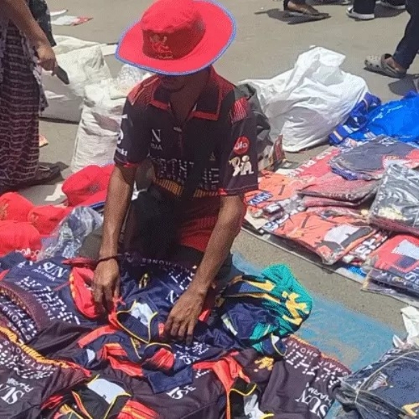 selling items like T-shirts, hats, glasses and more outside the stadium selling items like T-shirts, hats, glasses and more outside the stadium
