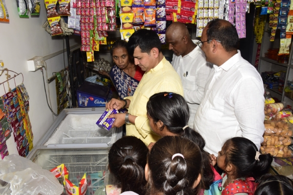 Minister of State Pravin Mali interacts with school children in Vadiya village
